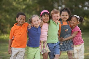 Portrait of multi-ethnic children hugging